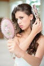 Pretty woman does hairstyle Royalty Free Stock Photo
