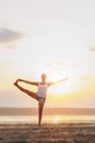 Pretty woman doing yoga at sunset outdoors Royalty Free Stock Photo