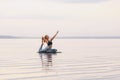 Pretty woman doing yoga at sunset outdoors Royalty Free Stock Photo