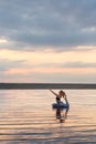 Pretty woman doing yoga at sunset outdoors Royalty Free Stock Photo