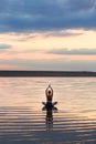 Pretty woman doing yoga at sunset outdoors Royalty Free Stock Photo