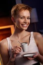 Pretty woman drinking coffee in cosy room Royalty Free Stock Photo