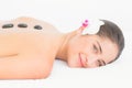 Pretty woman enjoying a hot stone massage Royalty Free Stock Photo