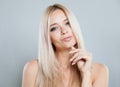 Pretty woman face close-up. Blonde model with fresh clear skin and healthy silky hair on white background Royalty Free Stock Photo
