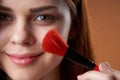 pretty woman face closeup makeup brush glamor Royalty Free Stock Photo