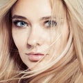 Pretty woman face. Natural healthy skin with freckles, blonde hair Royalty Free Stock Photo