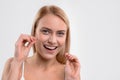 Pretty woman flossing her oral cavity Royalty Free Stock Photo