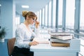 Pretty woman in glasses learning book, library Royalty Free Stock Photo