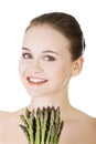 Pretty woman with healthy food - asparagus