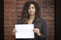 Pretty Woman Holding Blank Sign or Paper Royalty Free Stock Photo