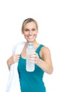 Pretty woman holding a bottle of water and a towel Royalty Free Stock Photo