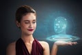 Pretty woman holding digital 3d head model on her hand