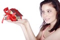 Pretty woman holding a miniature house