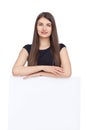 Pretty woman holding white blank paper