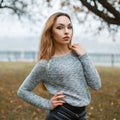 Pretty woman in a knitted sweater in a foggy autumn day Royalty Free Stock Photo