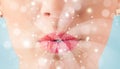 Pretty woman lips blowing abstract white lights Royalty Free Stock Photo