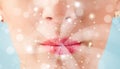 woman lips blowing abstract white lights - close up Royalty Free Stock Photo