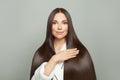 Pretty woman with long healthy straight hair on white background. Haircare concept