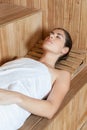 Pretty woman lying inside the sauna Royalty Free Stock Photo