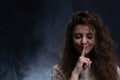 Pretty woman making silence sign with copy space on black background Royalty Free Stock Photo