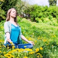 Pretty woman meditate in the park Royalty Free Stock Photo