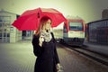 Pretty woman near the train travelling in station Royalty Free Stock Photo