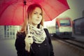 Pretty woman near the train travelling in station Royalty Free Stock Photo