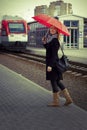 Pretty woman near the train travelling in station Royalty Free Stock Photo