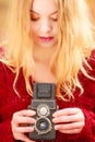 Pretty woman with old vintage camera.