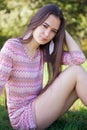 Pretty woman in the park sitting on grass Royalty Free Stock Photo