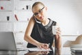 Pretty woman on phone doing paperwork Royalty Free Stock Photo