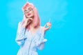 pretty woman pink hair glamor luxury sweets blue background Royalty Free Stock Photo