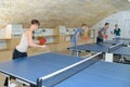 pretty woman playing ping-pong with friends Royalty Free Stock Photo