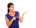 Pretty woman pointing to her left Royalty Free Stock Photo