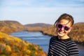 Pretty woman poses at the fall overlook in Lake of the Clouds Michigan in the Porcupine Mountains Wilderness State Park Royalty Free Stock Photo