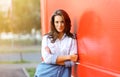 Pretty woman posing against colorful wall Royalty Free Stock Photo