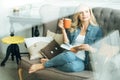 Pretty woman reading book at home Royalty Free Stock Photo