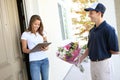 Pretty Woman Receiving Flowers Royalty Free Stock Photo