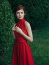 Pretty woman red dress walking luxury model outdoors Royalty Free Stock Photo