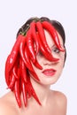 Pretty Woman with Red Hot Chili Peppers on Face Royalty Free Stock Photo