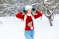 Pretty Woman in red knitted sweater with a deer standing in a wi Royalty Free Stock Photo