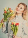 Pretty woman with red yellow tulips bunch Royalty Free Stock Photo