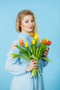 Pretty woman with red yellow tulips bunch Royalty Free Stock Photo