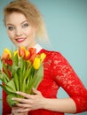 Pretty woman with red yellow tulips bunch Royalty Free Stock Photo