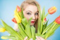 Pretty woman with red yellow tulips bunch Royalty Free Stock Photo