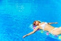 Pretty woman relaxing in swimming pool. Royalty Free Stock Photo