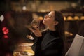 Pretty woman rest in restaurant with wineglass. Perfect wine. bar customer sit in cafe drinking alcohol. girl with long Royalty Free Stock Photo