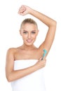 Pretty woman shaving armpit with razor. Royalty Free Stock Photo