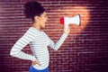 Pretty woman shouting with megaphone Royalty Free Stock Photo