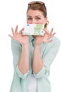 Pretty woman showing an one hundred euro note Royalty Free Stock Photo